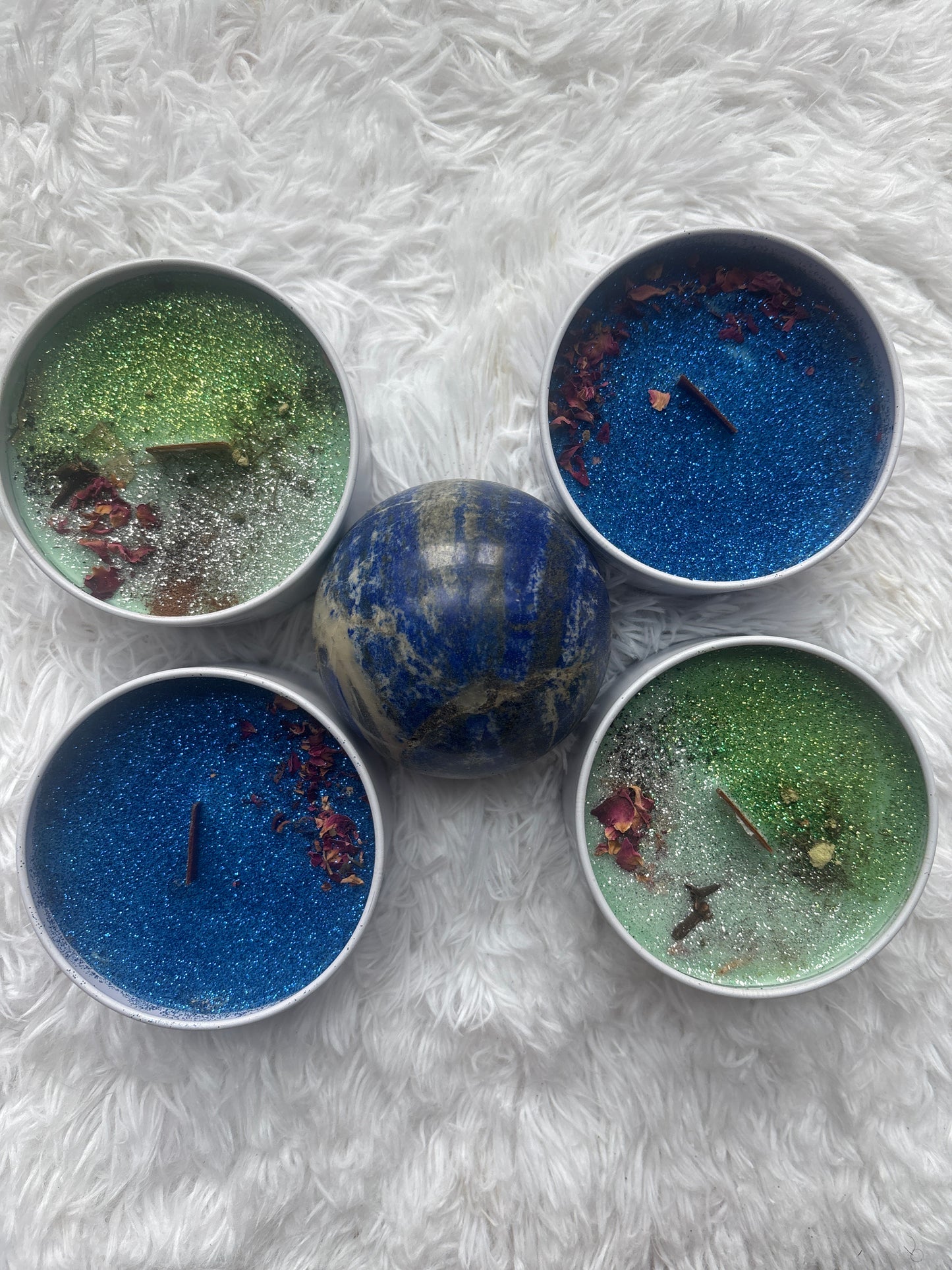 Ezili Danto conjure candle lit on devotional altar