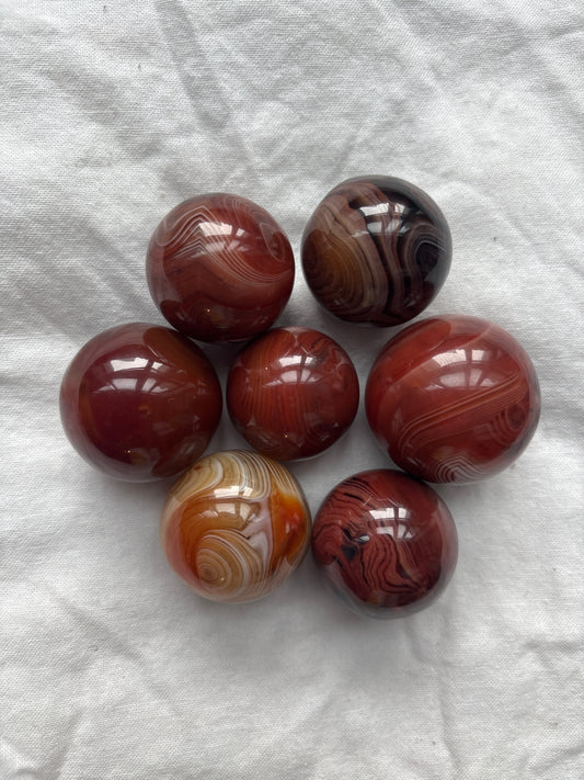 Sardonyx sphere crystal for strength, protection, and unshakeable confidence